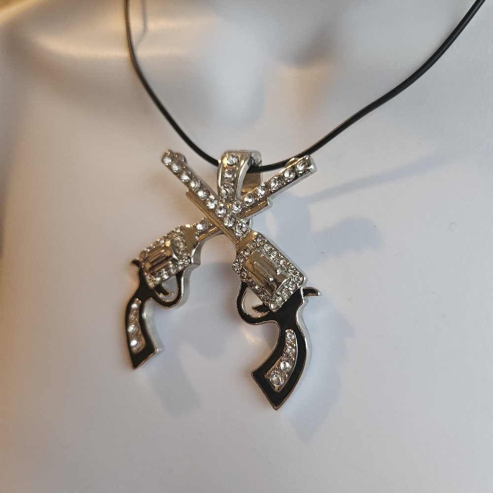 Crossed revolver silver tone rhinestone necklace